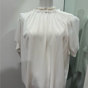 Aritzia’s Wilfred Cream Blouse with Puff Sleeves